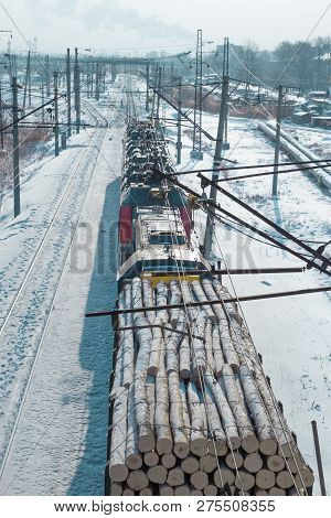 Rail Cars Loaded With The Wood Being Transported From Nearby Mines To Power Plants In Winter