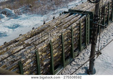 Rail Cars Loaded With The Wood Being Transported From Nearby Mines To Power Plants In Winter