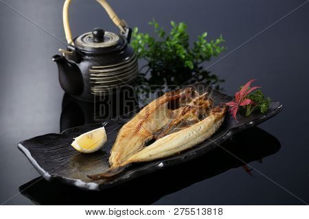 Fried Yellow Croaker In A Dark Plate