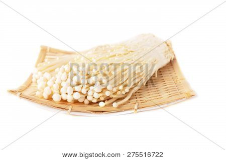 Japanese Mushrooms Enokitake In A Bamboo Plate On White Background