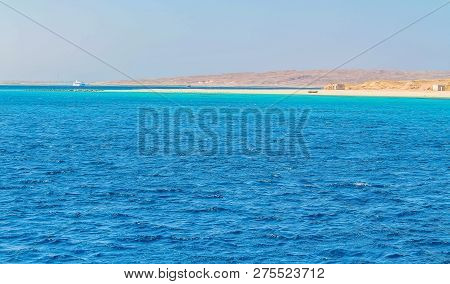 White Yacht On A Sunny Day On The Red Sea Surrounded By Clear Blue Water