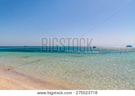 White Yacht On A Sunny Day On The Red Sea Surrounded By Clear Blue Water