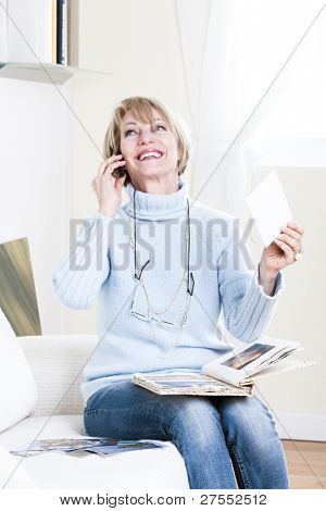 Woman looking at her grandson photographs