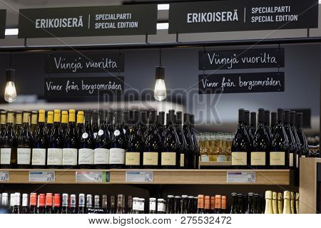 HELSINKI, FINLAND - SEPTEMBER 8, 2018: Shelf with wine bottles in the department store Stockmann. Completed in 1926, the department store is one of the largest on Scandinavian peninsula