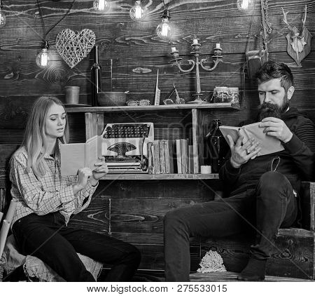 Soulful Evening Concept. Father Instills Love To Books For His Daughter. Girl And Man On Calm Faces 