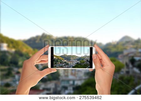 A Tourist Is Taking A Photo Of A Small Town In Lattari Mountains Regional Park In Italy During The S