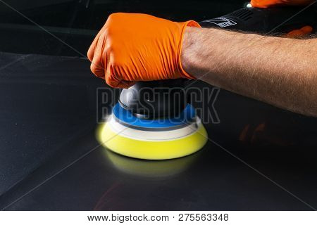 Car Polish Wax Worker Hands Applying Protective Tape Before Polishing. Buffing And Polishing Car. Ca
