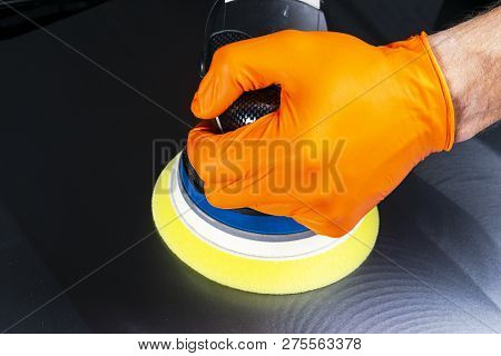 Car Polish Wax Worker Hands Applying Protective Tape Before Polishing. Buffing And Polishing Car. Ca