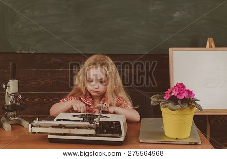 Little Girl Type On Retro Typewriter Archaism In School. Future And Archaism, Vintage Filter.