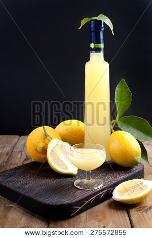 Limoncello In A Bottle And A Small Shot With Liquor. The Traditional Alcoholic Beverage Of Italy, Fr