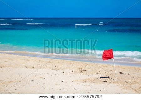 Red Flag Warning Sign At The Beack No Swimming