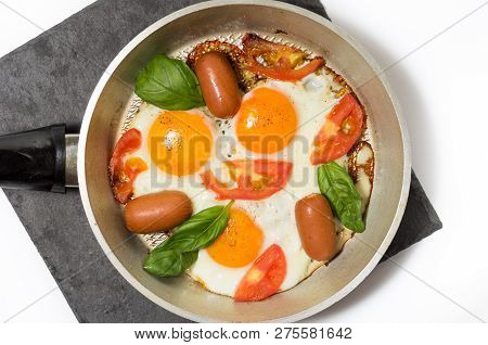 Photo scrambled close. Fried eggs in the pan. Top.