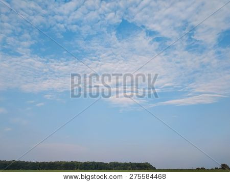 Cloudscape With White Altocumulus Clouds At Evening