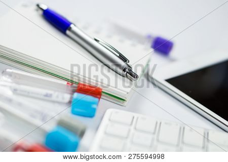 Medicine Bottles For Samples Next To Computer Tablet And Computer Keyboard In Medicine, Closeup On W