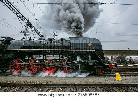 Prague, Czech Republic / Europe - December 15 2018: Old Black Steam Engine, Red Wheels, Made In 1948