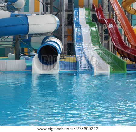 Water park. Blue pool slide swimming. Aquapark.