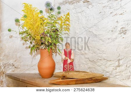 Jug With Flowers And Russian Clay Toy
