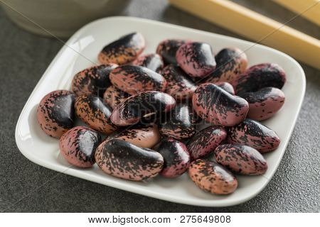Large scarlet runner beans close up on a dish