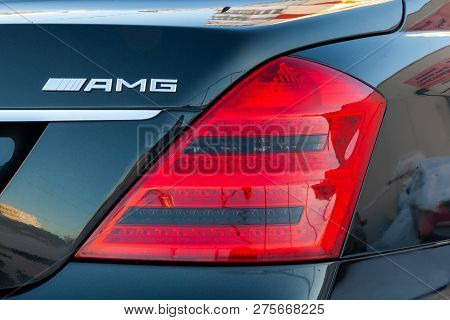 Novosibirsk, Russia - 08.01.2018: Reflective Sunlight Taillight Red With Metal Chrome Sign On A Blac
