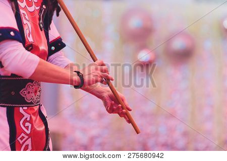 Man In National Costume Play National Music Instrument. Kurai.