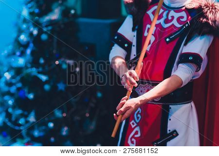Man In National Costume Play National Music Instrument. Kurai.