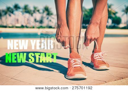 New Year New Start fitness new year resolution runner woman tying up laces of running shoes getting ready to run for weight loss. Athlete on summer beach