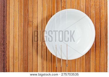 Table With Needles For Acupuncture. Silver Needles For Traditional Chinese Acupuncture Medicine On A