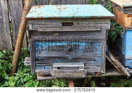 Old Empty Beehive In The Garden Near The Fence