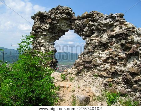 Man-made Rock Made From Stones With A Round Hole, Through Which You Can See The Landscape Of Khust. 
