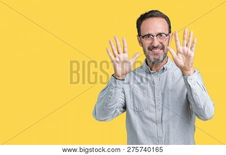 Handsome middle age elegant senior man wearing glasses over isolated background showing and pointing up with fingers number ten while smiling confident and happy.