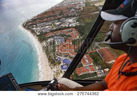 Flight Over The Coast Of The Dominican Republic. The Pilot Of The Company 