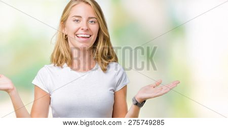 Beautiful young woman wearing casual white t-shirt over isolated background Smiling showing both hands open palms, presenting and advertising comparison and balance