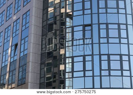 Office House With A Reflecting Facade From Glass