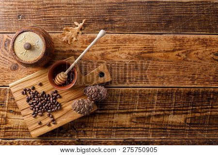 Barrel Of Honey With Pine Nuts On A Wooden Background. Flat Lay. Copy Space.