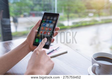 Chiang Mai, Thailand - August 18,2018: Woman Holding Huawei With Icons Of E-commerce And Online Shop