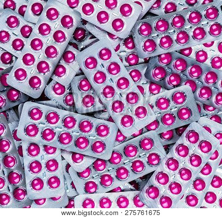 Pile Of Round Pink Tablets Pill In Blister Pack. Pharmaceutical Industry. Pharmacy Products. Prescri