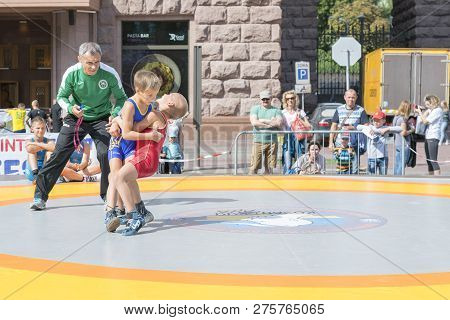 Ukraine, Kiev, Ukraine 09.09.2018 Boys On Street Tatami Engaged In Greek Wrestling.