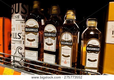Kyiv, Ukraine - December 19, 2018: Bottles Of Bushmills Whiskey On Shelves In A Supermarket. The Old
