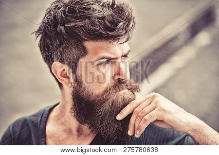 Man With Beard And Mustache Looks Thoughtful Or Troubled Bearded Man On Concentrated Face Touches Be