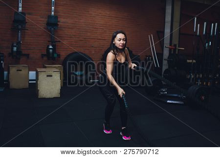 Woman Training With Battle Ropes In Gym, Doing Intense Hard Training.
