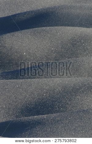 Mounds Of Snow Give A Dune-like Abstract Pattern, With The Partially Melted Crystals Glittering In T