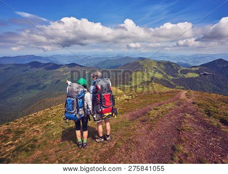 Couple - Active Hikers Hiking Enjoying View Looking At Mountain Forest Landscape In Yosemite Nationa