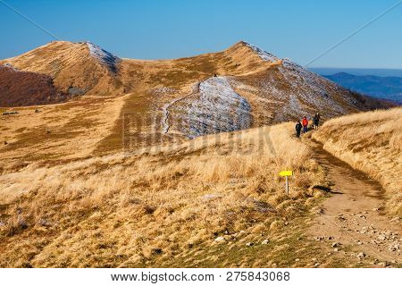 Wetlina, Poland, November 12, 2011: A Group Of Tourists Hiking On A Trail In Polonina Wetlinska On A