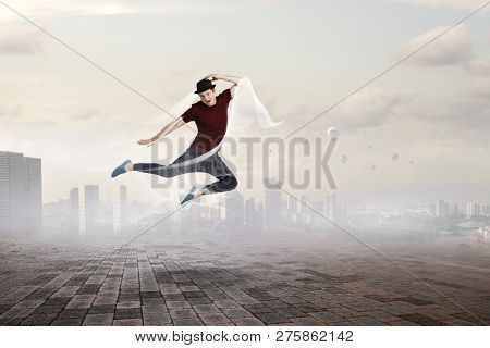 Dance is his world . Mixed media
