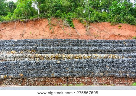 Gabion Wall Made Of Stones In The Steel Mesh, Used As A Fence On A Slope For Protection Landslide