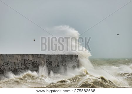 Stunning Waves Crashing Over Harbor Wall During Windy Storm At Newhaven On English Coast