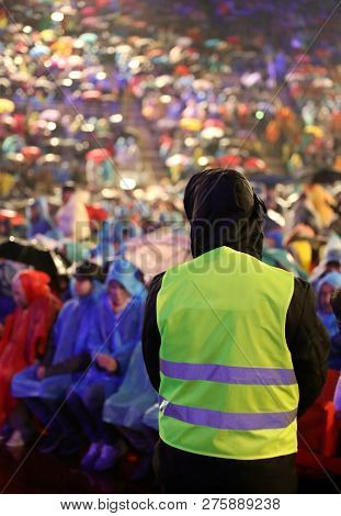 Supervisor With High Visibility Jacket To Control The Spectators During A Live Concert