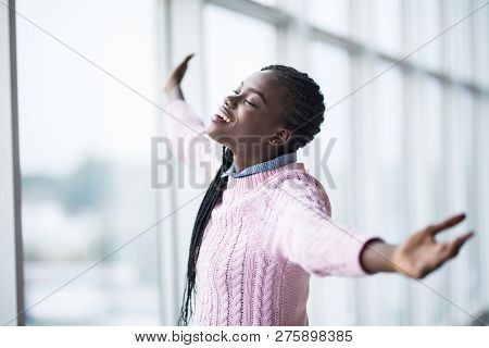 Portrait Afro American Woman With Reised Hands Up Celebrate Success And Goods Results On Pamoramic W