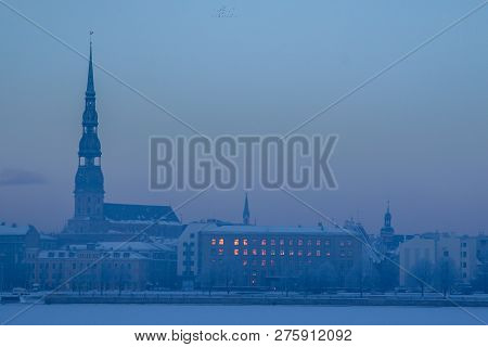 Riga View In Winter; Riga, Capital City Of Latvia In Winter Time. View Of Church In Winter. View Of 
