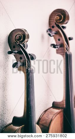 In Selective Focus Of Scroll And Pegbox Of Violin,vintage And Art Tone,blurry Light Around